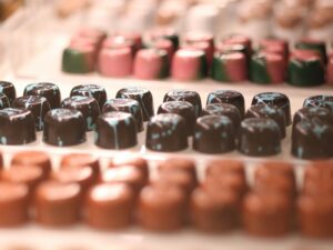 Rows of different colored chocolate.